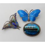 Two silver and enamel butterfly brooches by Charles Horner (af), a Norwegian example by Ivar Holth