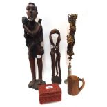 Two carved African sculptures, a cinnabar style metal box, a candlestand and a mug Condition Report: