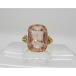 An 18ct gold ring set with a large pink gem, size approx M, weight 6.7gms Condition Report: Shank
