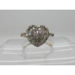 A 9ct gold diamond heart shaped cluster ring, set with estimated approx 0.40cts of brilliant and