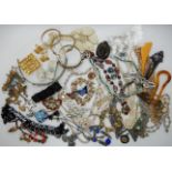 A collection of vintage costume jewellery to include items by Sherman, Kramer and Lisner and a