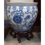 A Chinese blue and white fishbowl on stand Condition Report: Available upon request