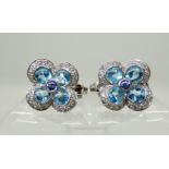 A pair of 18ct white gold Mappin & Webb topaz, tanzanite and diamond flower earrings, with clip