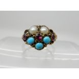 A yellow metal Victorian flower ring set with turquoise pearls and pink gems, size H approx,
