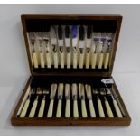 A cased twenty-four piece EP fish cutlery set Condition Report: Available upon request