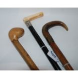 An ebony and ivory handle walking cane, two other walking canes and parasol (4) Condition Report: