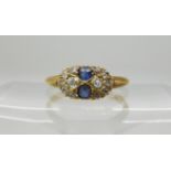 An 18ct gold sapphire and diamond cluster ring set with estimated approx 0.20cts of old cut