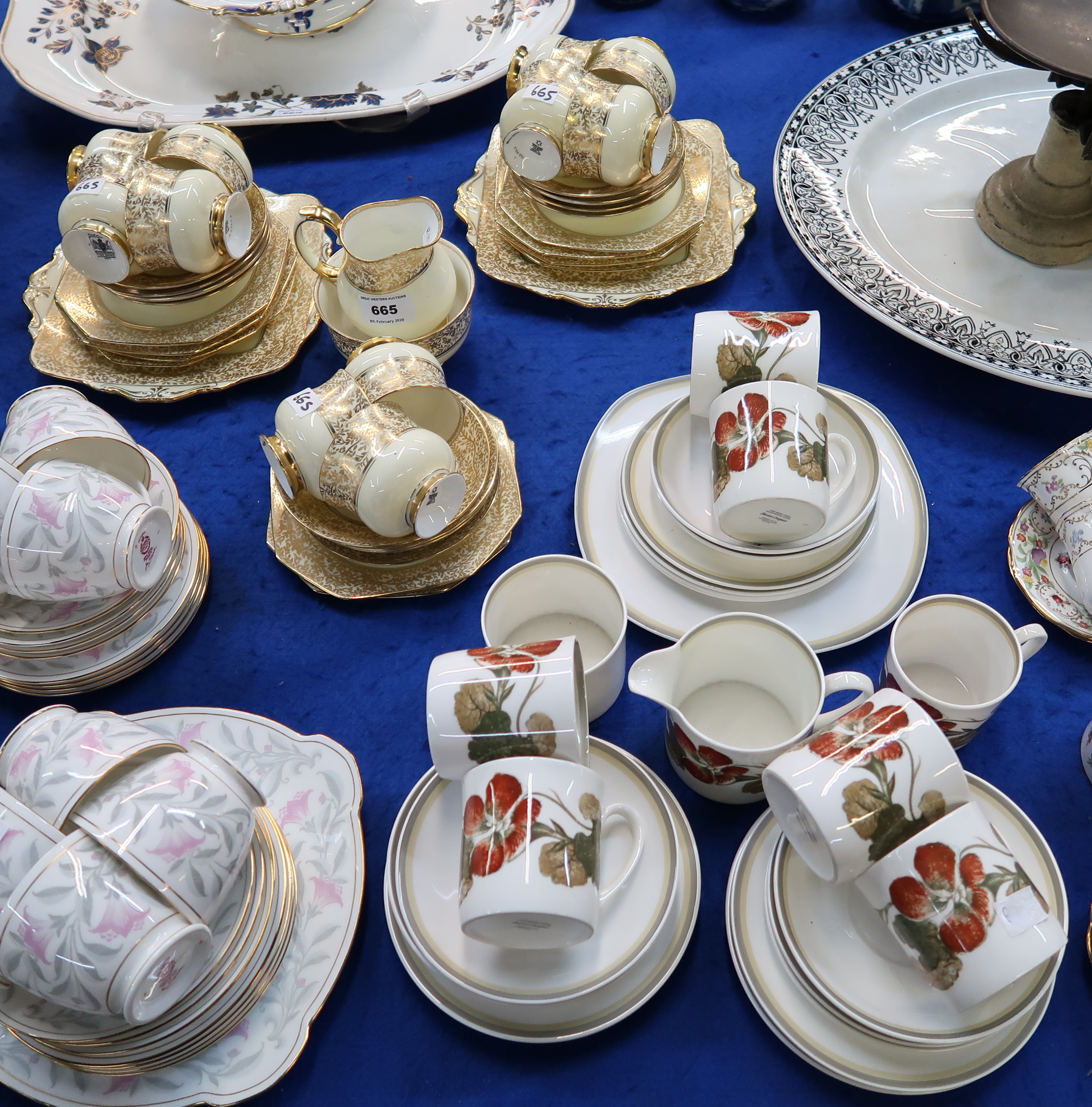 A Paragon cream glazed teaset with gilt leaf decoration comprising eleven cups, twelve saucers,
