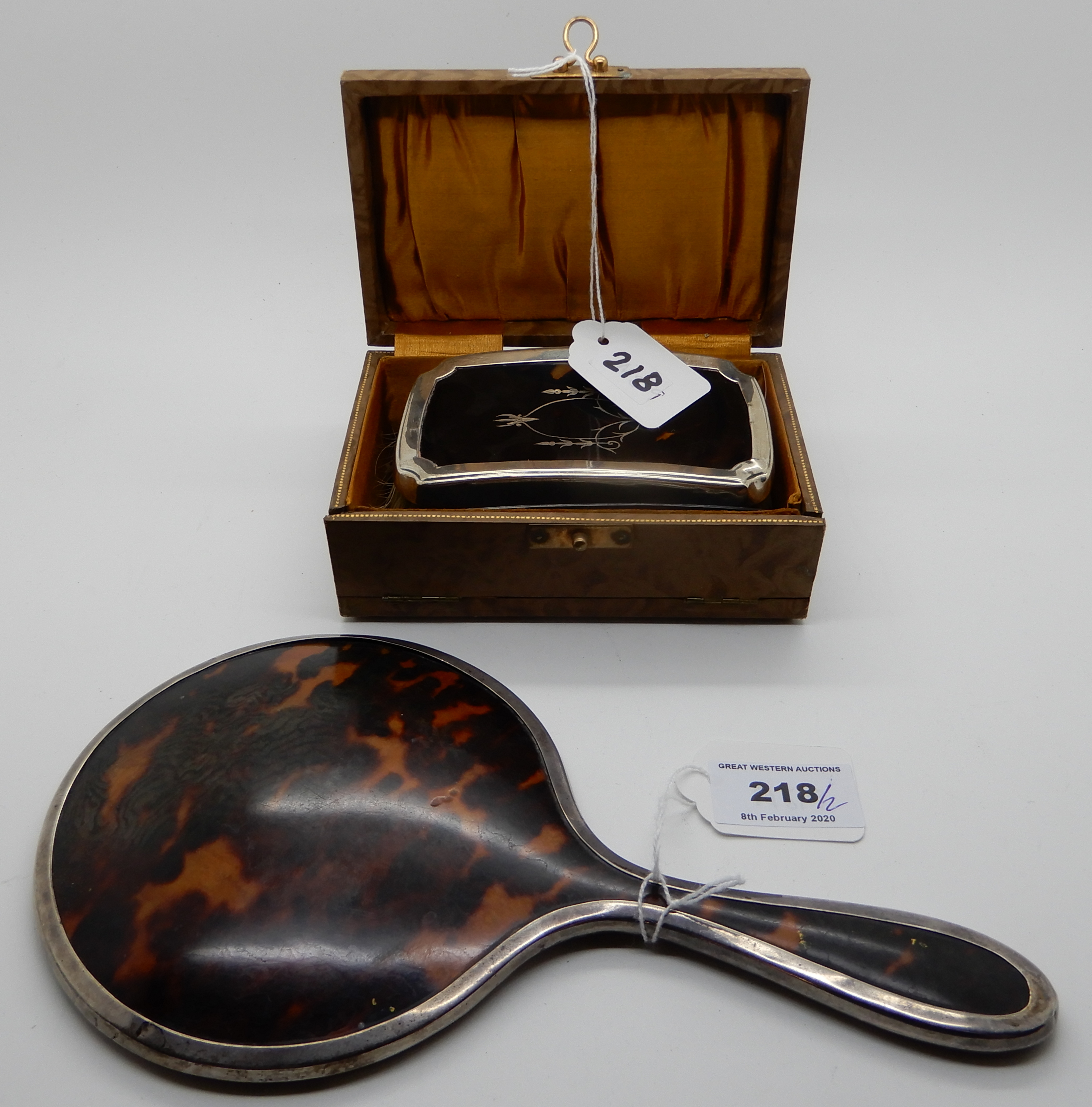 A lot comprising a cased silver and tortoiseshell brush, Birmingham 1926 and a silver and