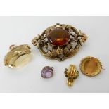 A 9ct gold citrine fob seal, a yellow metal brooch set with green gems, a yellow metal amethyst