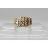 A 14k gold ring set with estimated approx 0.88cts of brilliant cut diamonds, finger size K1/2,