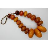 An aged faux amber statement bead necklace Condition Report: Not available for this lot