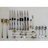 A box of loose cutlery, including sterling silver teaspoons Condition Report: Available upon