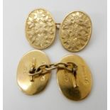 A pair of 9ct gold floral engraved cufflinks with Chester hallmarks for 1910, weight 8.3gms