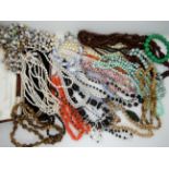 A triple strand of freshwater pearls, carnelian beads and other vintage items Condition Report: