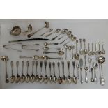 A collection of assorted silver teaspoons, tongs, sauce ladles and a toddy ladle (def), 796gms