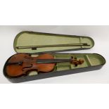 A two piece back violin 35cm with indistinct label to the interior of Antonious Stradivarius made in