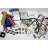 A Royal Ulster Rifles badge, medal ribbons, silver golfing medals, costume jewellery and lighters