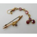 A 9ct gold amethyst thistle brooch (af) and a single yellow metal drop earring set with rubies,