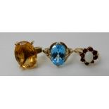 An 18ct retro citrine ring size O1/2, a 9ct gold blue topaz ring size V and a garnet and opal