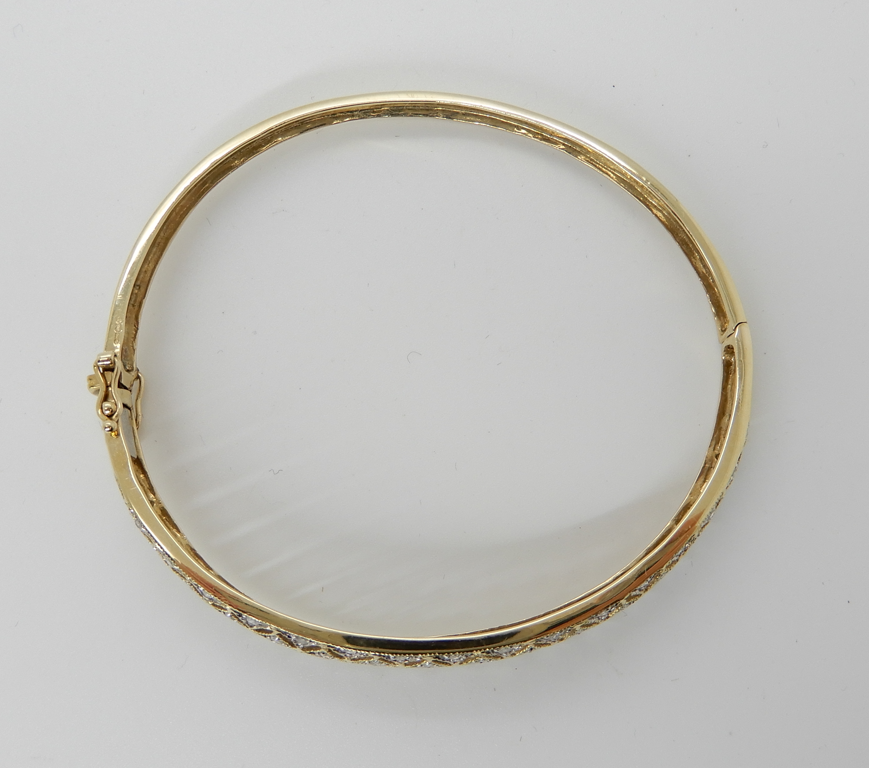 A 9ct gold diamond set pierced bangle, weight 8.8gms Condition Report: Available upon request - Image 2 of 3