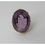 A 9ct gold large amethyst ring approx 25mm x 19mm x 12mm, finger size M, weight 11.5gms Condition