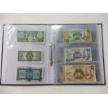 An album of British banknotes - British Linen Bank one pound, five pounds, Bank of Scotland, one
