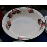 A large bowl with handpainted decoration of roses in the style of Wemyss Condition Report: Available