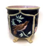 A majolica jardiniere decorated with birds and bulrushes Condition Report: Available upon request