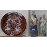 A large imari charger and two ceramic figures Condition Report: Available upon request