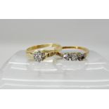 An 18ct gold ring set with a diamond size M, together with an 18ct three stone diamond ring (one