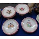 A Victorian dessert set decorated with flowers comprising two low tazzas, a higher tazza and nine