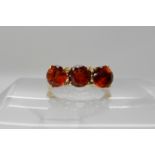 A 9ct gold deep orange red citrine set ring size P, weight 3gms Condition Report: Available upon