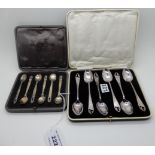 A lot comprising a cased set of six Danish silver mustard spoons and a cased set of six EPNS