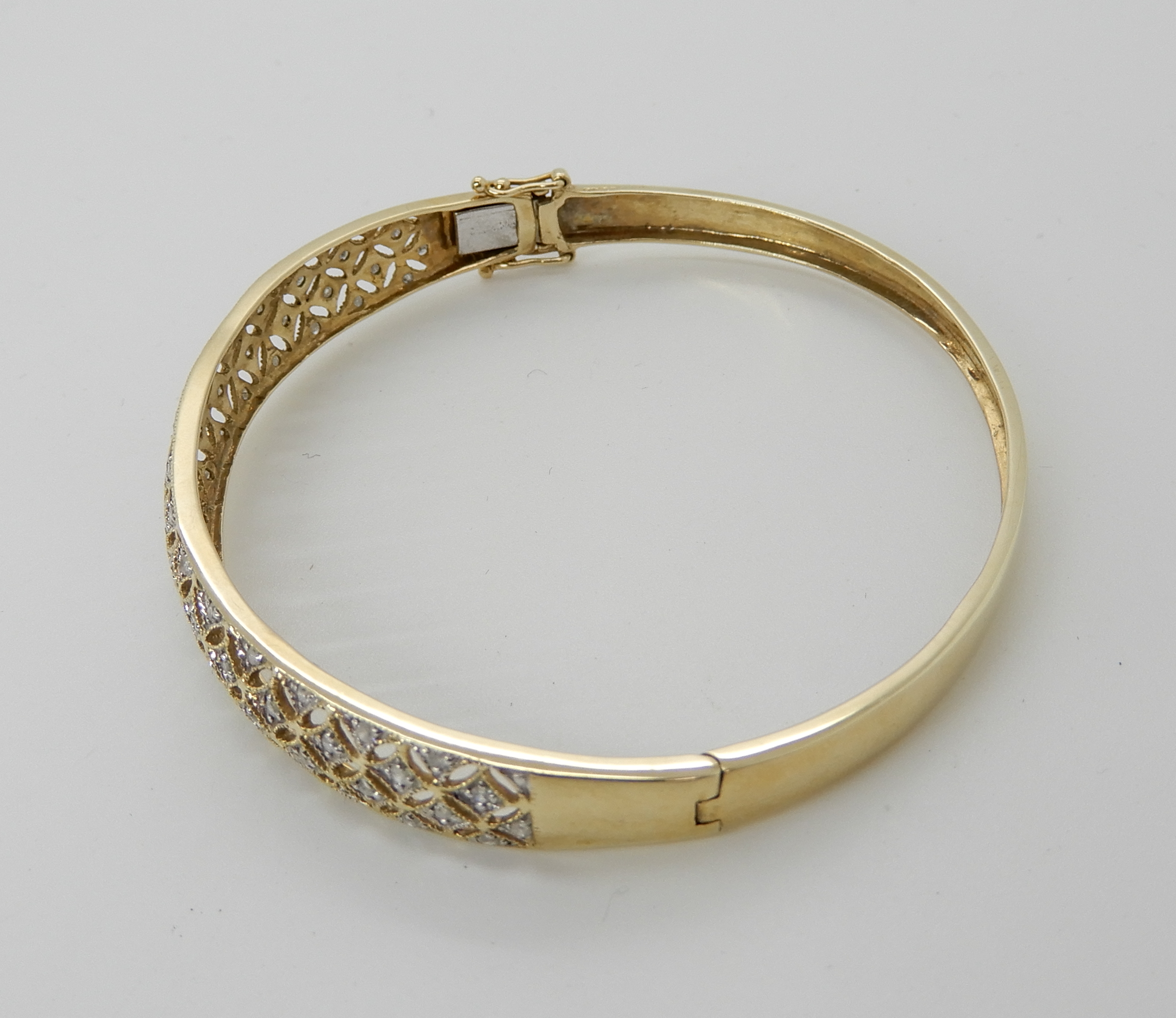 A 9ct gold diamond set pierced bangle, weight 8.8gms Condition Report: Available upon request - Image 3 of 3