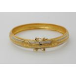 An 18ct gold bi-colour bangle, weight 10.8gms Condition Report: Available upon request