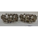 A pair of silver plated wine coasters embossed with fruit and vine leaves, 15cm diameter Condition