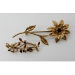 A 9ct gold garnet flower brooch (pin not gold) and a 9ct sapphire brooch, combined weight 7.3gms
