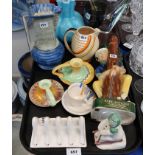 A collection of decorative ceramics including Shelley candlesticks, Wade jug, Carlton Ware leg