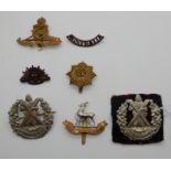 A lot comprising two Cameron cap badges with four others, Royal Warwickshire, Australian