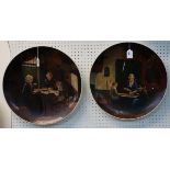 A pair of pottery chargers with painted Dutch interior scenes Condition Report: Available upon