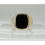A 9ct gold onyx gents signet ring, size R1/2, weight 5.4gms Condition Report: Available upon
