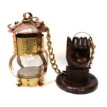 An Arts and Crafts hall lamp with carved wooden hand hanging mount Condition Report: Available
