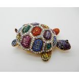 A Butler & Wilson multicolour gem set turtle brooch Condition Report: Not available for this lot