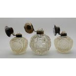 A lot comprising a silver topped scent bottle, Birmingham 1906 and a pair of scent bottles,