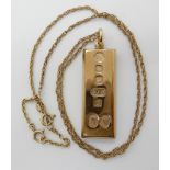 A 9ct gold Charles and Diana ingot pendant and rope chain, (length 46cm) combined weight 33.8gms