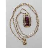 A 9ct gold diamond and pink gemstone pendant, length of chain 42cm, weight 4gms Condition Report:
