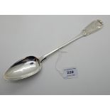 A silver basting spoon, Edinburgh 1812, fiddle pattern, the terminal with shell motif and bearing