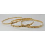 Two yellow metal bangles stamped 750, weight 11.5gms, and one stamped 14k, weight 6.3gms Condition