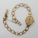A 9ct gold ladies Sovereign wristwatch, weight including mechanism 8.5gms Condition Report: